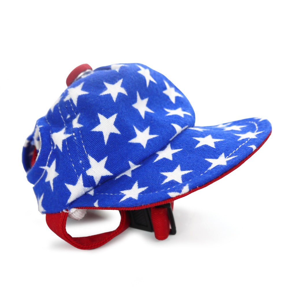 Blue star-print dog hat with red brim and fabric chin strap