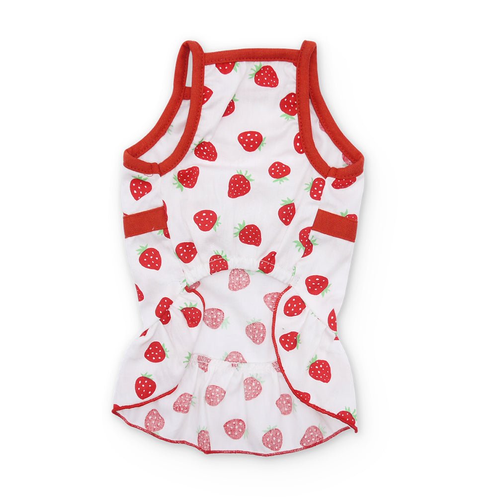 White dog dress with red strawberry print and ruffled waist hem, sleeveless with back straps