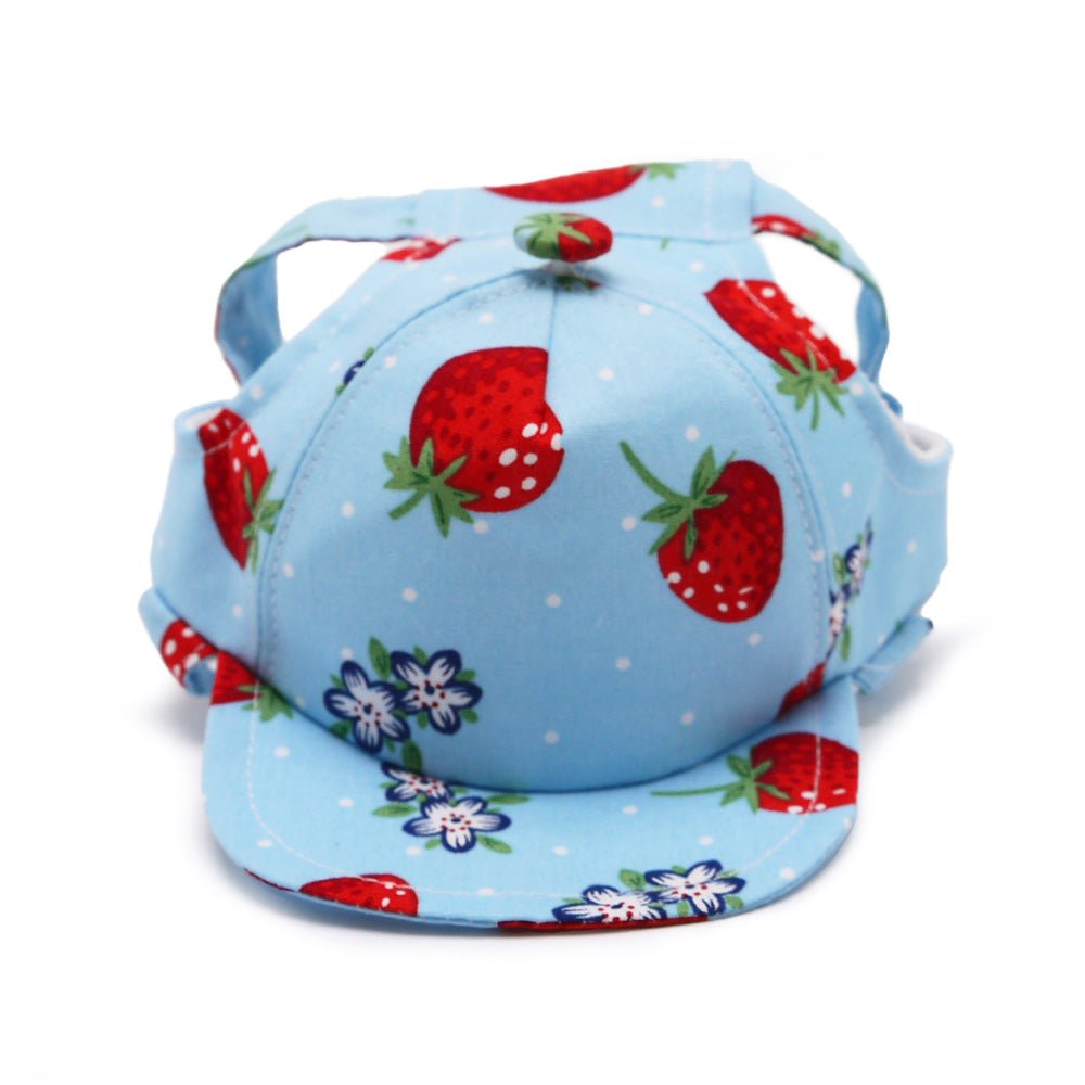 Light blue strawberry-print cap with red berries, green leaves, adjustable strap