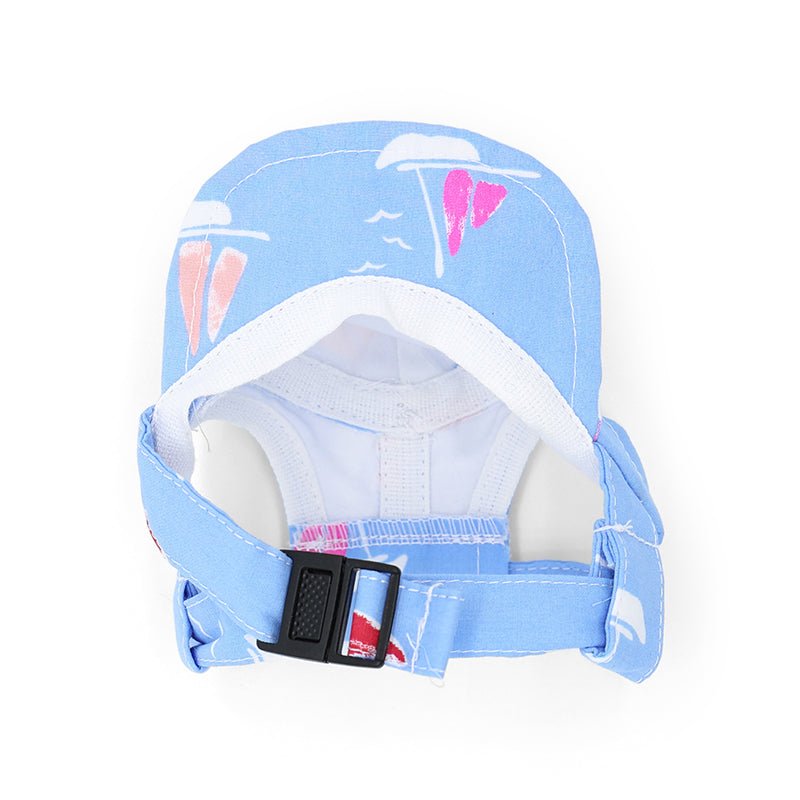 Blue beach hat with sailboat print, chin strap, and adjustable buckle
