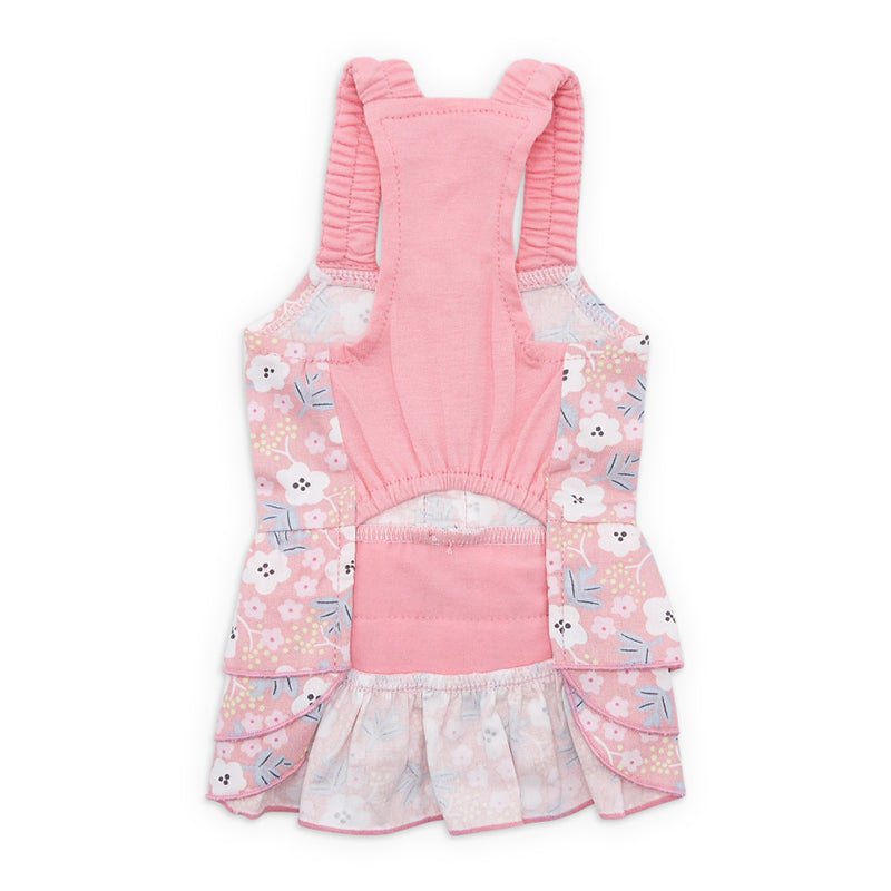 Pink patterned pet dress back view with solid pink panel and gathered ruffle hem