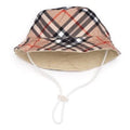 Tan plaid bucket pet hat with wide brim and chin strap