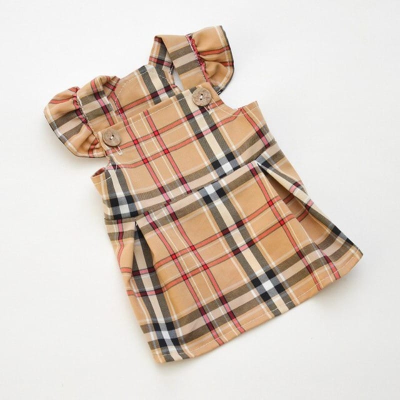 Tan plaid dog dress with ruffle strap design and button closure