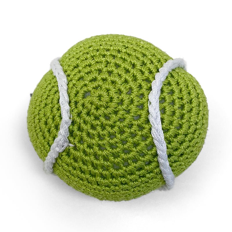 Crocheted tennis ball toy in green with white seam lines