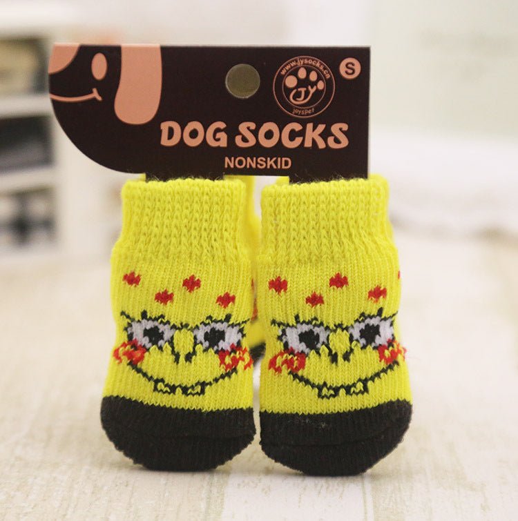 Yellow dog socks with black toe, red paw details, and smiling faces; non-skid