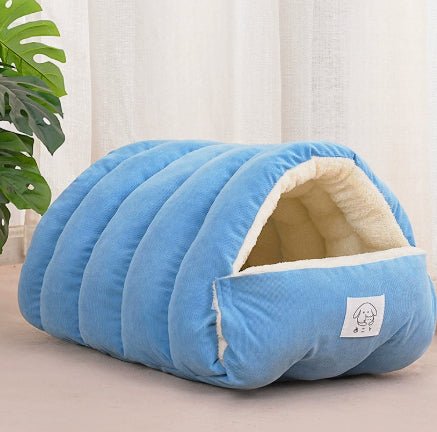 Blue padded pet cave bed with arched tunnel opening and plush sherpa lining