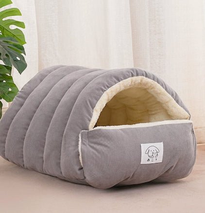 Gray padded pet cave bed with arched tunnel opening and plush sherpa lining
