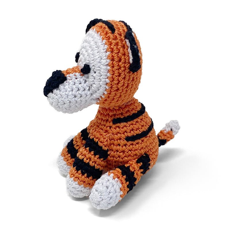 Crochet tiger plush toy, side view, orange-and-black striped body, white muzzle, black ears