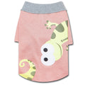 Peach dog polo T-shirt with gray collar and cartoon dinosaur-face graphic