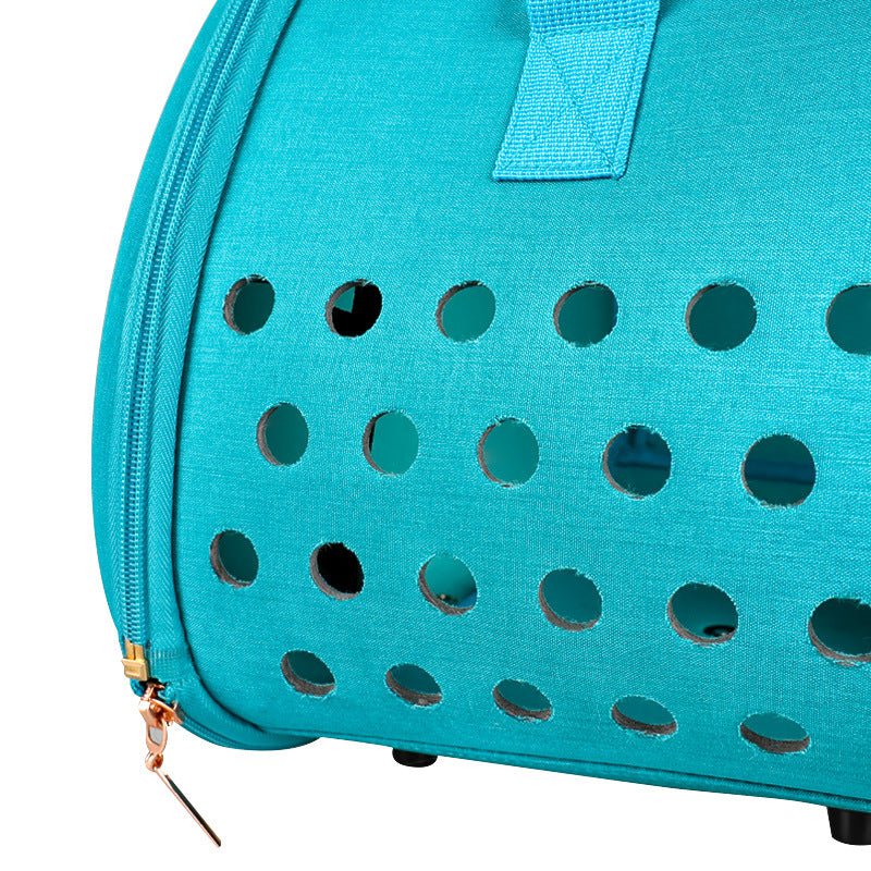 Sky-blue transparent pet backpack detail: front ventilation holes and zipper edge
