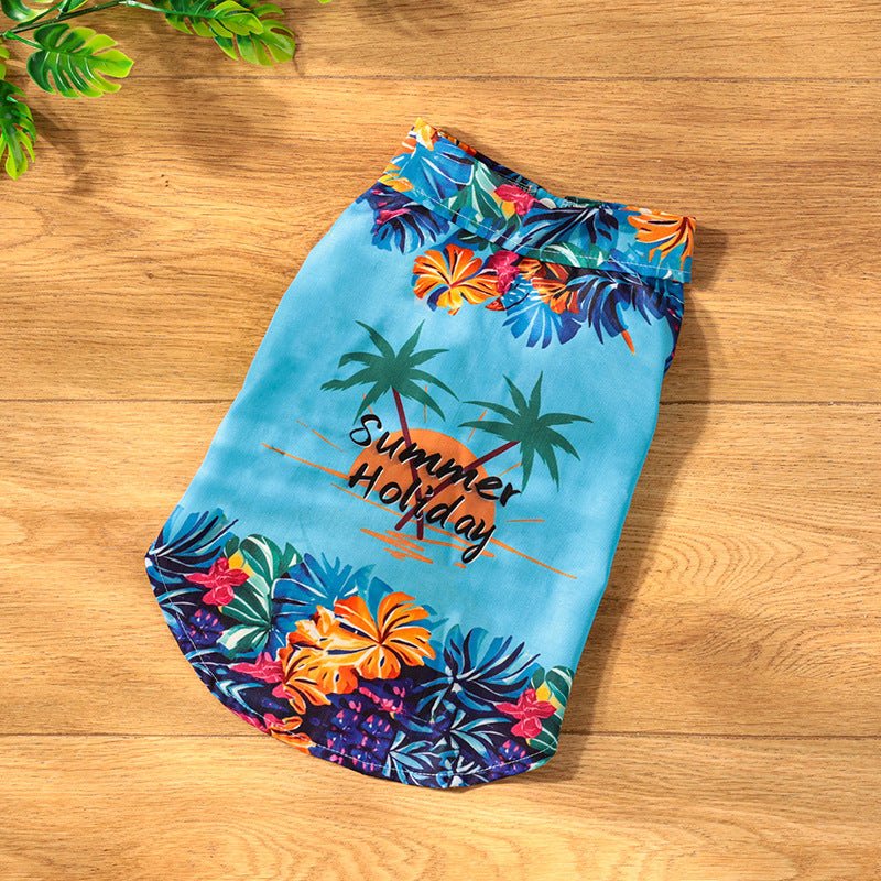 Light blue summer holiday dog shirt with palm leaf and hibiscus floral print