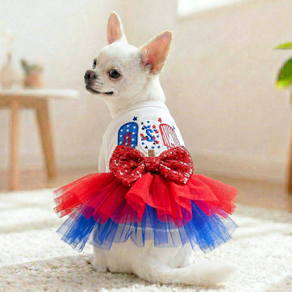 White dog tutu dress with large red sequined bow and red-blue layered tulle skirt