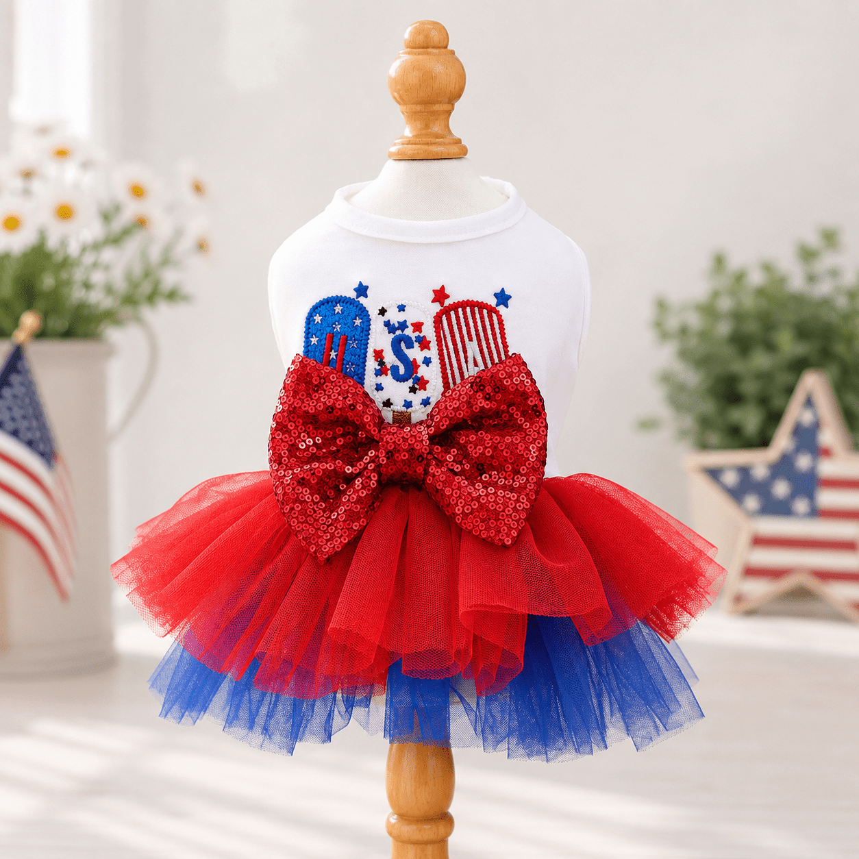 USA patriotic dog tutu dress with white top, red sequin bow, and red-blue tulle skirt