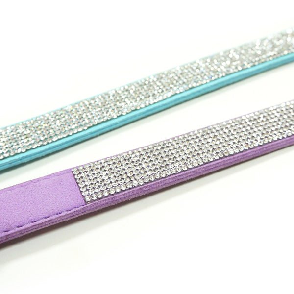 Close-up of rhinestone trim on baby blue and lavender pet collar bands