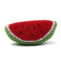 Crochet watermelon toy slice with red striped top, green rind, and white edging