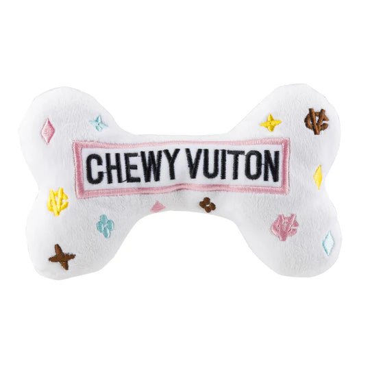 Chewy Vuiton white plush bone with “CHEWY VUITON” label and scattered colorful symbols