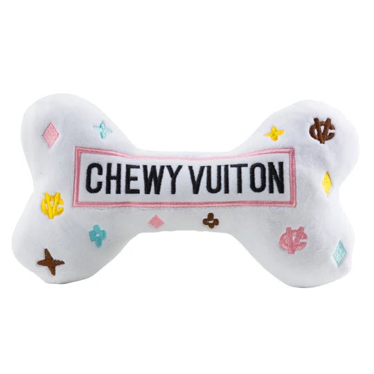 Chewy Vuiton white bone plush with “CHEWY VUITON” label and colorful icon pattern