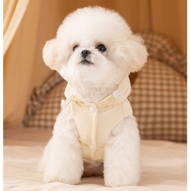 Cream fleece dog vest with bow tie and puffy hood, front view