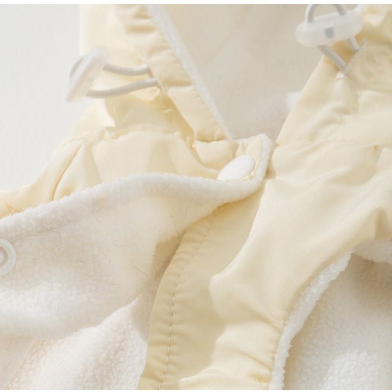 Cream puffy dog vest hood with soft fleece lining and stitched trim