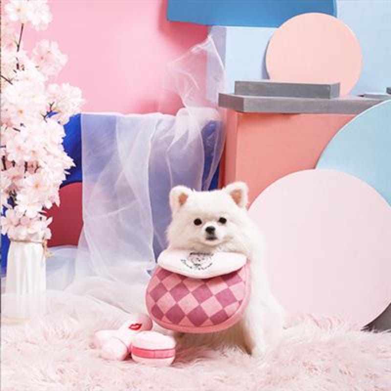 Plush dog handbag with matching toy set, shown with a dog beside it