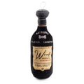 Black plush dog bottle toy with Woof Reserve Cabarknet label and hanging loop